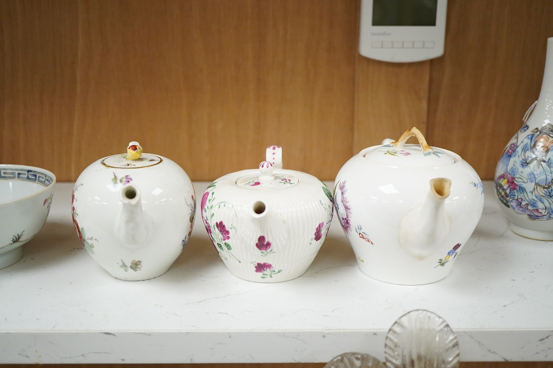 An 18th Furstenburg porcelain teapot and cover, a Wallendorf porcelain teapot and cover and a Meissen style teapot, 12cm high